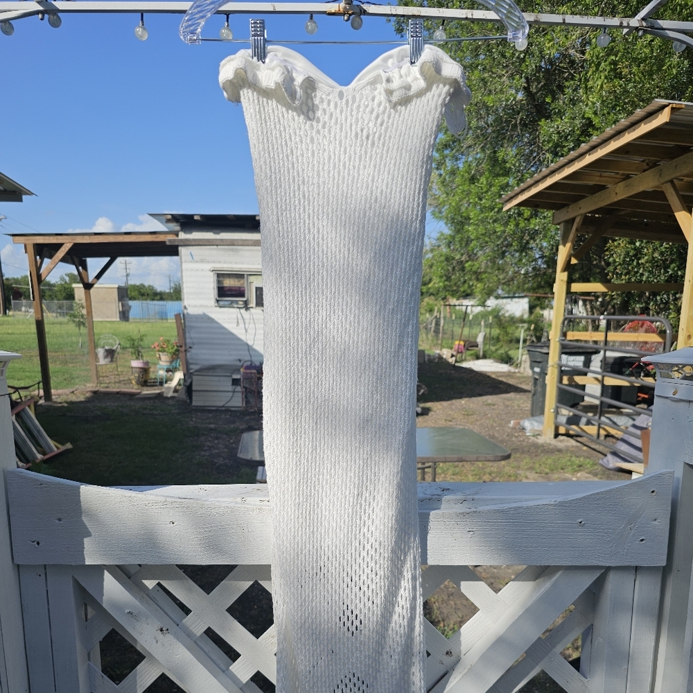 White crochet dress with ruffles and mesh details